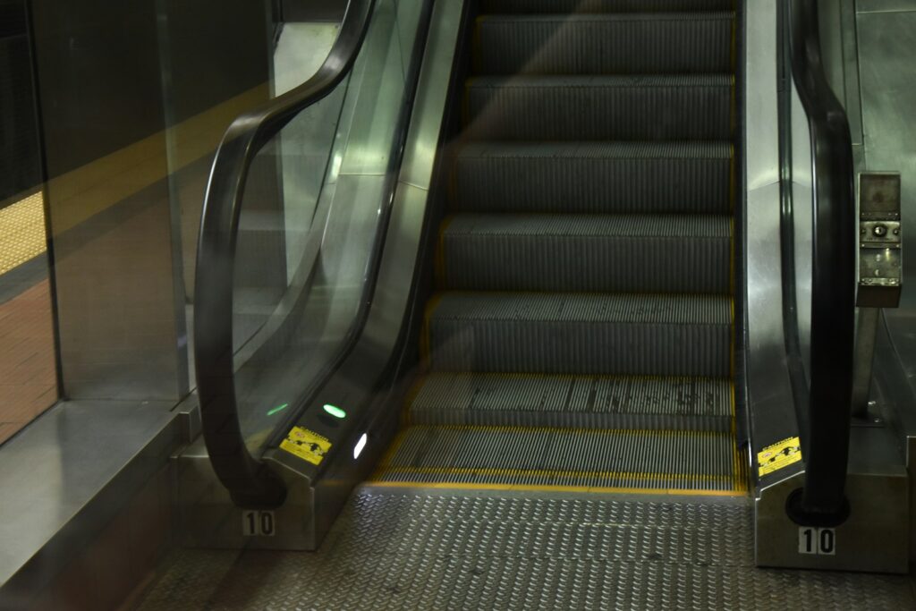 shallow focus photo of escalator
